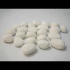 24 White ceramic pebbles